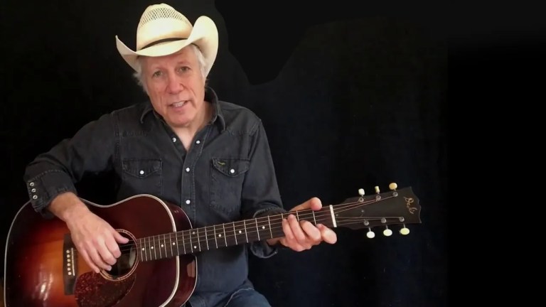 Maurice Tani performing Ragtime Cowboy Joe on guitar.