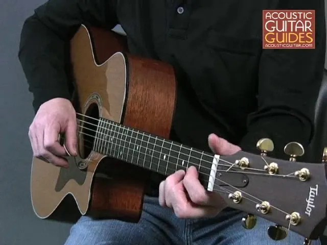 Closeup of acoustic guitar player
