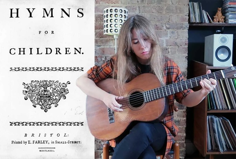 Gwenifer Raymond playing acoustic guitar