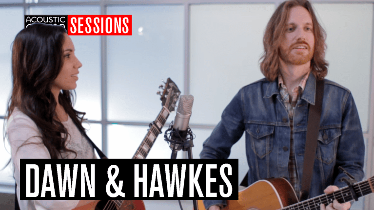 Dawn & Hawkes performing on their guitars
